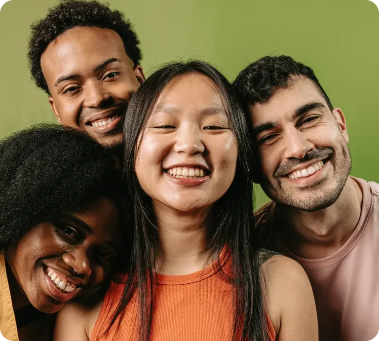 there are three people smiling and posing for a picture together
